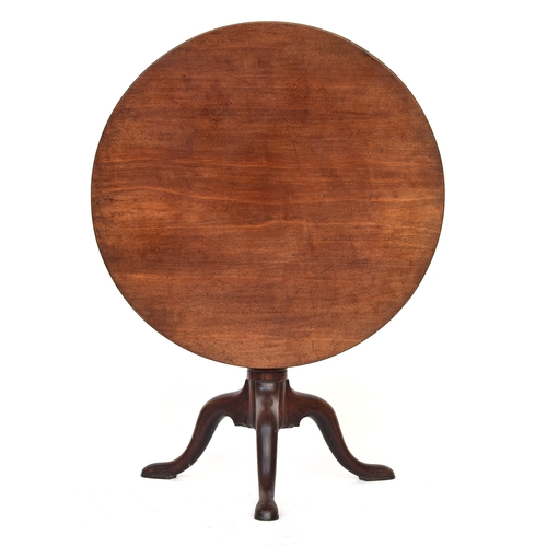 589 - A George III mahogany tripod table, tip-top with birdcage action, gun barrel column support on three... 