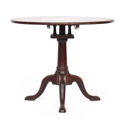 589 - A George III mahogany tripod table, tip-top with birdcage action, gun barrel column support on three... 