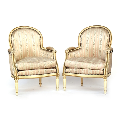 679 - A pair of 19th century French painted and parcel gilt armchairs