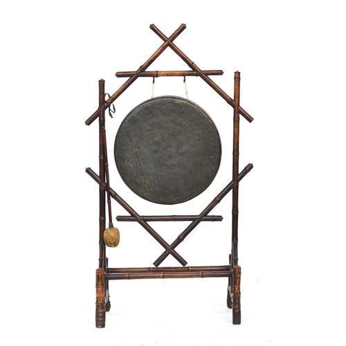 718 - A Victorian bamboo dinner gong, the stand 61cm high, 106cm high