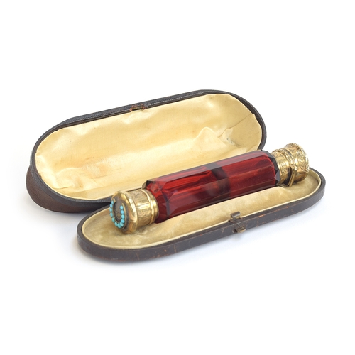 140 - A 19th century Morden & Co. double ended scent and smelling salts bottle, faceted ruby glass, with s... 