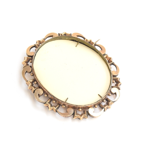 15 - A 19th century yellow metal brooch with glazed reverse containing a lock of hair, front glass absent... 