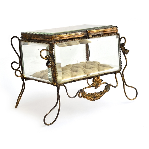 148 - A 19th century French gilt metal mounted glass casket, on raised wire legs with floral decoration, s... 