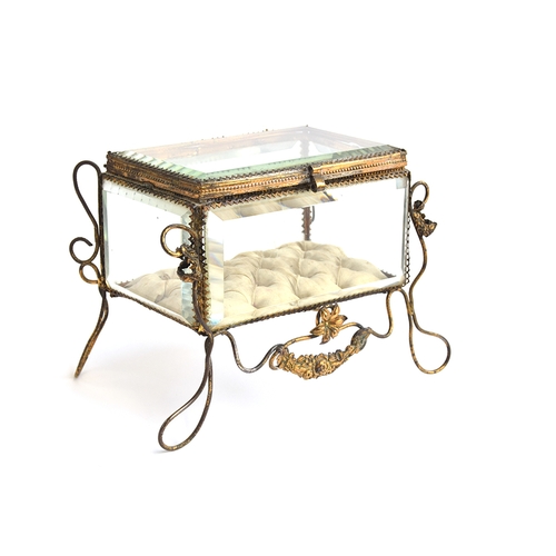 148 - A 19th century French gilt metal mounted glass casket, on raised wire legs with floral decoration, s... 