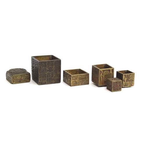 180 - A set of bronze Chinese nesting seals, the six seals of square section, all with seal script charact... 