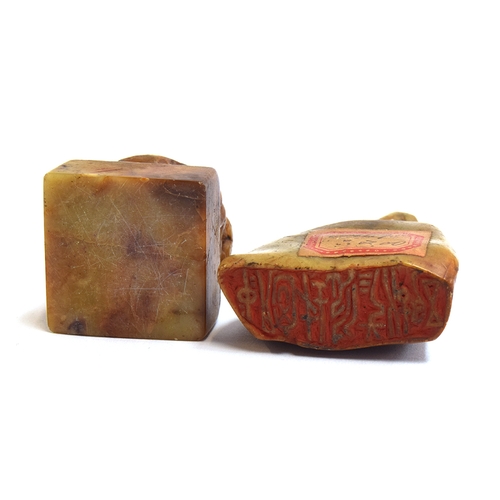 182 - A Chinese carved shoushan stone seal surmounted by a Qilin,  6.2cm high, with label to reverse; toge... 