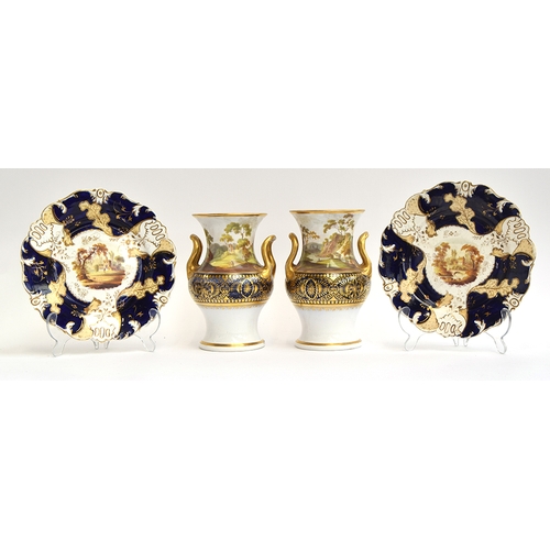 240 - A pair of twin handled porcelain urns hand painted with figures within Romantic landscapes, heighten... 