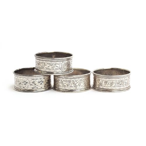 134 - A set of four engraved silver napkin rings, Birmingham 1876, 2.1ozt