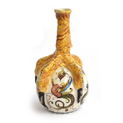 246 - An Italian Majolica Certosa di Firenze monastic pilgrim's flask, in the form of a claw grasping an o... 