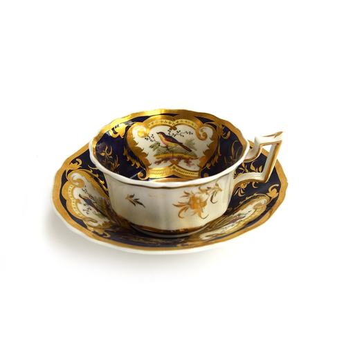 225 - A pair of 19th century Grainger teacups and saucers c.1830, Royal Flute shape, panels of floral spra... 