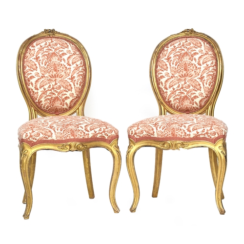 681 - A pair of Louis XV style giltwood side chairs, floral cresting rail, shaped stuffover seats, on carv... 