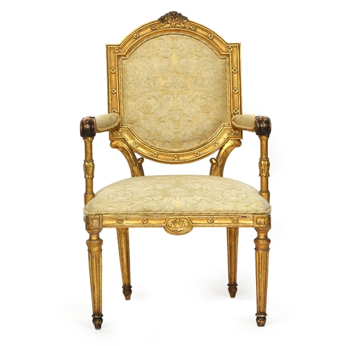 682 - A Louis XVI style fauteuil, floral cresting over a square back, the upholstered arms on lotus suppor... 