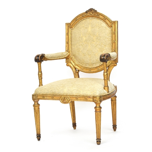 682 - A Louis XVI style fauteuil, floral cresting over a square back, the upholstered arms on lotus suppor... 