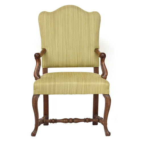 689 - An Italian provincial walnut open armchair, 18th century, the cabriole legs joined by turned H stret... 