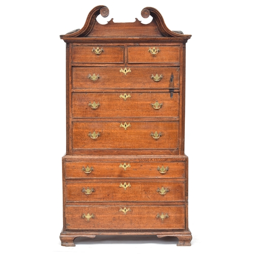 571 - A George II oak chest on chest, magnificent swan neck pediment over two short and three graduating d... 