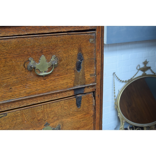 571 - A George II oak chest on chest, magnificent swan neck pediment over two short and three graduating d... 