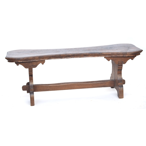 692 - An Italian walnut bench, waisted top, on end supports with stretcher, 151cm long, 54cm high

Provena... 