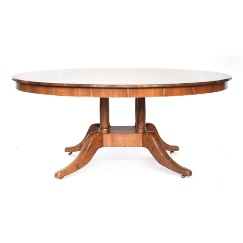 640 - A contemporary bespoke made walnut circular dining table, on a four column base with swept legs and ... 