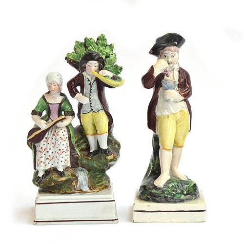 205 - Two 19th century Staffordshire pearlware figures, a barefooted man holding grapes and a wine glass, ... 