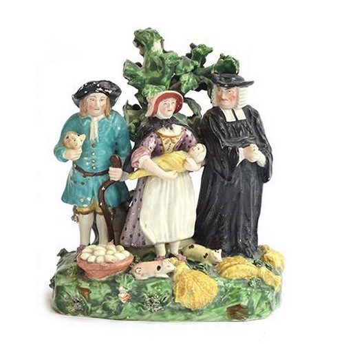 206 - A late 18th century Derby porcelain 'Tithe Pig' figure group, modelled as a couple and the parson in... 