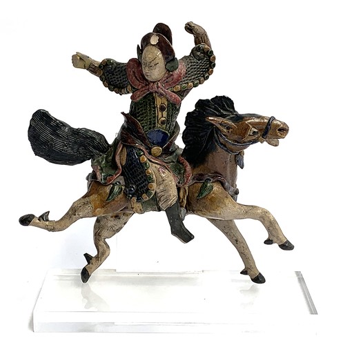 188 - A Chinese polychrome glazed ceramic figural roof tile modelled as a warrior on horseback, 30cm high,... 