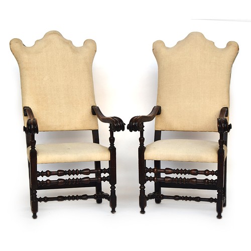 693 - A pair of 19th century Renaissance revival throne chairs, upholstered shaped backs, carved outward s... 