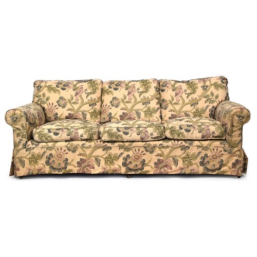 709 - A George Smith three seater sofa, on turned legs and brass casters, 220cm wide, 103cm deep, the back... 