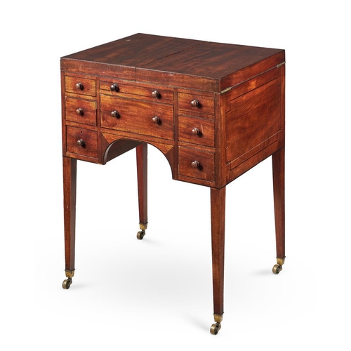 627 - A George III mahogany and ebony strung dressing table, late 18th century, of campaign type, the hing... 