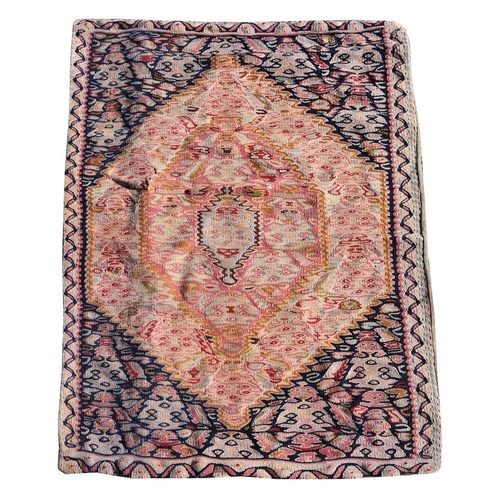 743 - A North West Persian kilim rug, with rhomboid central design within rich swirling 
spandrels, approx... 