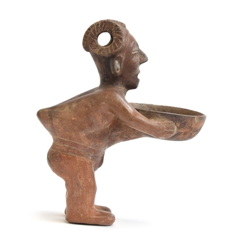 171 - A Pre-Colombian pottery figural vessel in the form of a man holding a dish, 27cm high

Provenance: p... 