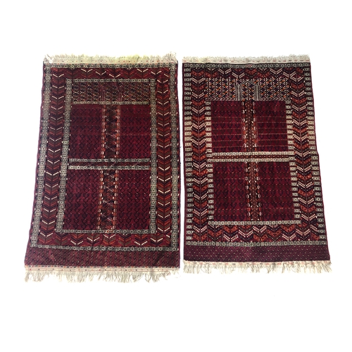 727 - A near pair of red ground rugs, the larger 176x119cm