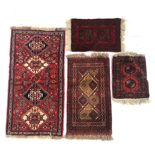 728 - A lot of four small rugs, the largest 69x133cm