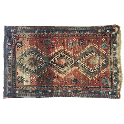 732 - A West Persian rug, three serrated central lozenges, triple border, 265x172cm