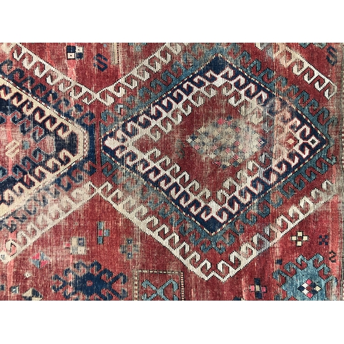 732 - A West Persian rug, three serrated central lozenges, triple border, 265x172cm