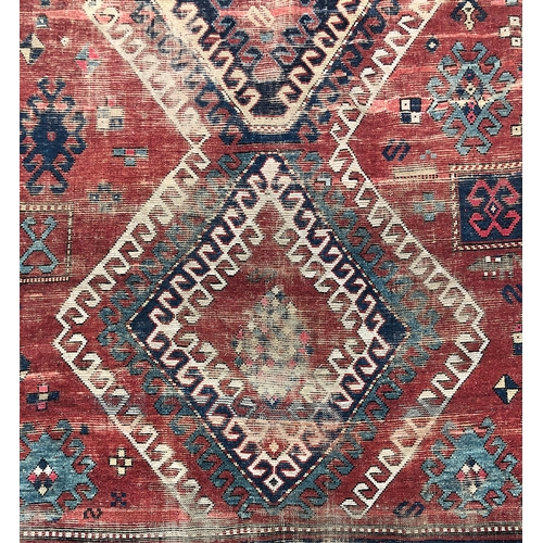 732 - A West Persian rug, three serrated central lozenges, triple border, 265x172cm