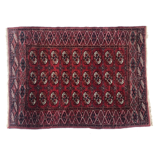 733 - A red groung Tekke rug, 148x205cm