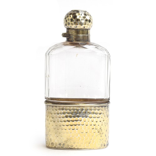 130 - A Victorian glass and silver gilt hip flask, London 1898, hammered finish, 14cm high