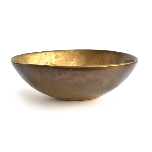 161 - An extremely heavy studio brass bowl, stamped to base 2/6, 38cm wide