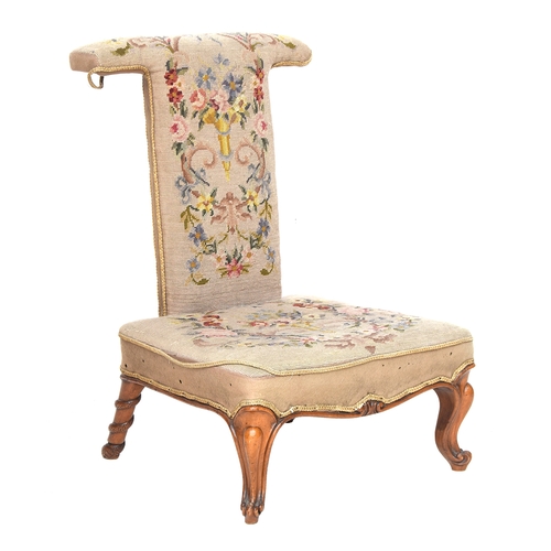 702 - A small high backed tapestry chair with serpentine carving to the back legs