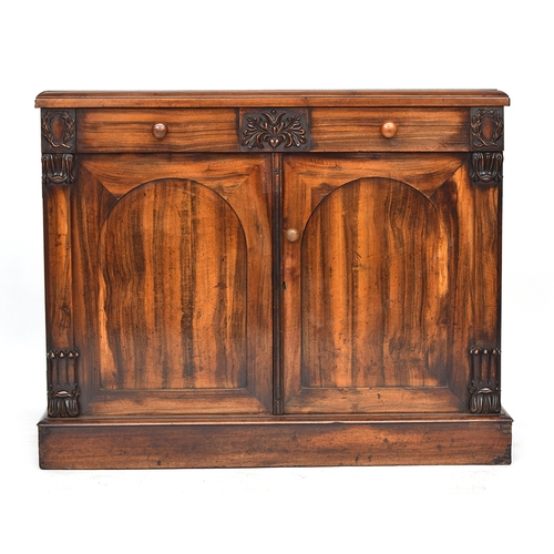 615 - An early Victorian goncalo alves chiffonier base, the moulded top over single drawer and cupboard, o... 