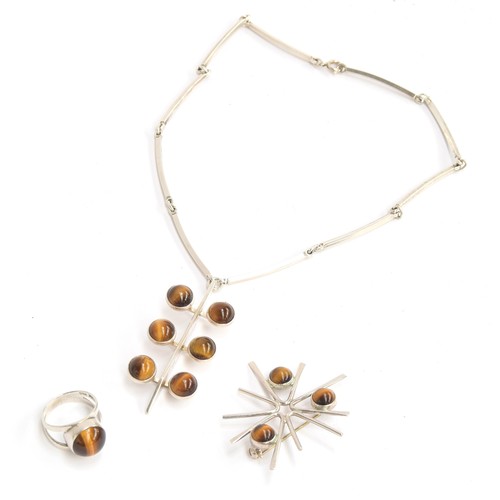 46 - Three pieces of Modernist silver and tigers eye jewellery, comprising a necklace by Niels Erik, bear... 