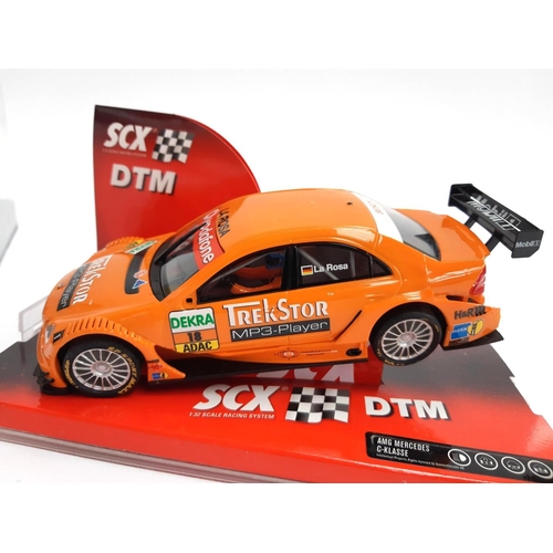 119 - A Carrera Evolution VW Golf GTI, boxed, together with an SCX AMG Mercedes C-Class, boxed