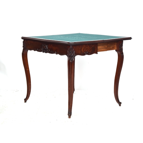 607 - A French mahogany card table, pull out action, foldover shaped top with green baize lining, carved a... 