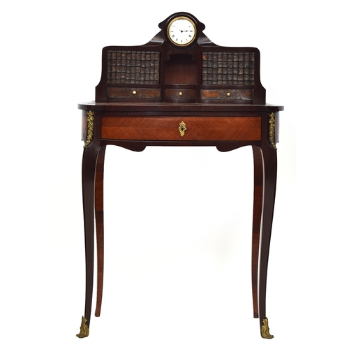 622 - A 19th century French bureau de dame, the superstructure with central clock, over two concealed comp... 