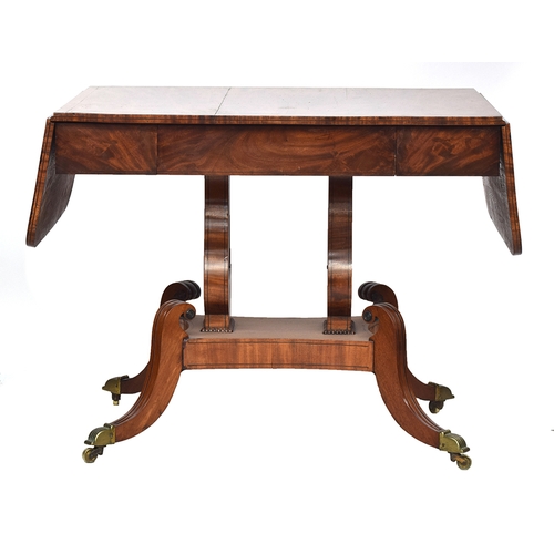 628 - A Regency mahogany sofa table, drop leaf to each end, single drawer, raised on lyre supports and fou... 