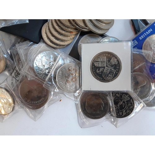 36 - A large quantity of commemorative coins to include Queen Mother 1980 (13), Churchill (9), Charles an... 