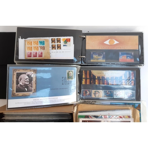 132 - A large quantity of Royal Mail presentation packs and first day covers in 2 albums and a box, to inc... 