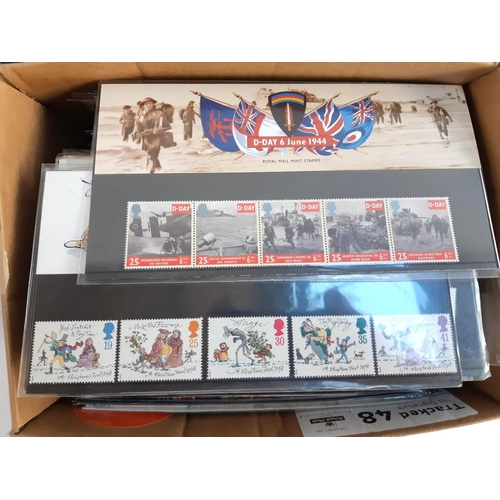 132 - A large quantity of Royal Mail presentation packs and first day covers in 2 albums and a box, to inc... 