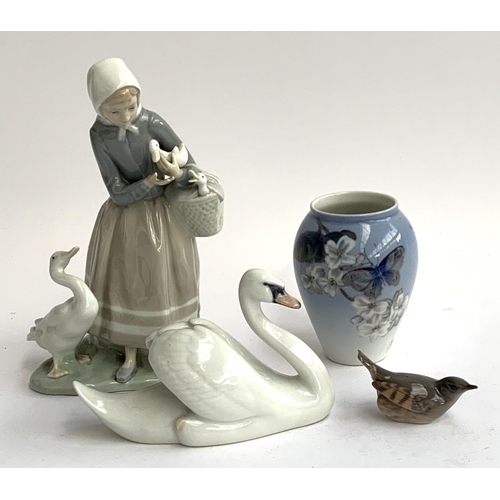 71 - A Royal Copenhagen vase, Swan and bird figurine; together with a Lladro figurine of a girl holding a... 