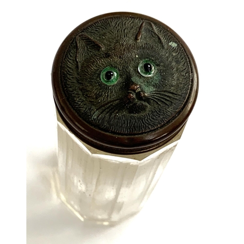 136 - A nickel topped glass inkwell; together with an Edwardian dressing table pot, the lid with cat mask ... 